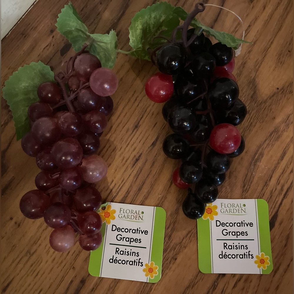 two bunches of artificial decorative grapes